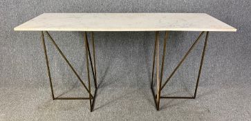 A contemporary marble topped console table on twin pedestal metal base. (Repair to marble as