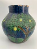 An Arts and Crafts lustre glaze pottery vase with fruit tree design. H.28cm