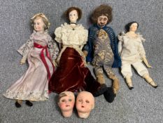 A collection of vintage and antique dolls to include two doll's heads. H.31cm (largest)