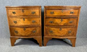 A pair of mid Georgian style walnut bedside chests. H.78 W.61 D.46cm