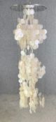 A large contemporary hanging chandelier made from capiz shells. H.144cm