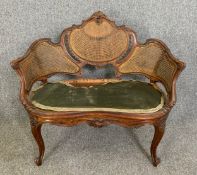 A 19th century walnut Louis XV style canape of small size. H.80 W.91 D.54cm