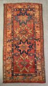 A hand knotted Shirvan runner with repeating star medallions on a burgundy field, inscribed in the