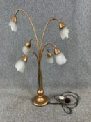 A contemporary gilt metal six branch table lamp with frosted shades. H.90cm