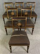 A set of six Regency dining chairs painted and parcel gilt with lion mask detail. H.86 W.54 D.