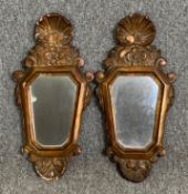 A pair of early 20th century Rococo carved giltwood wall mirrors. H.44 W.22cm (each)