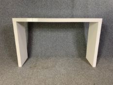 A contemporary lacquered console table. H.80 W.130 D.35cm