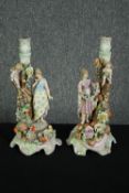 A pair of C G Schierholz & Sohn candlesticks with figural, cherub and flower encrusted stems, C.