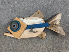 A driftwood sculpture of a fish, signed Tim Cromarty to the reverse and titled 