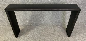 A contemporary lacquered console table. H.86 W.150 D.28cm