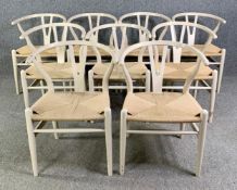 A set of nine Hans Wegner style wishbone chairs, painted with woven seats. H.75 W.52 D.55cm