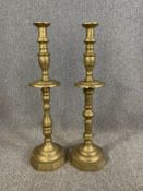 A pair of large 19th century engraved brass candlesticks. H.73cm (each)