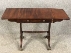 A 19th century mahogany sofa table with drop flap action, of small size. W.112 D.46 H.71cm.