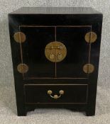 A small Chinese black lacquered cabinet. H.80 W.62 D.52cm