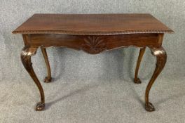Console table, 19th century Irish mahogany with wheatsheaf carved decoration, fitted with frieze