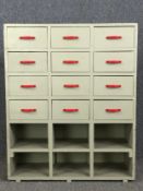 A vintage painted bank of drawers fitted with pigeon holes beneath. H.98 W.82 D.30cm.