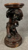 A 19th century Venetian style stand with carved figural polychrome support. H.60cm