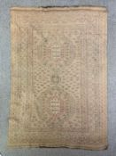 An Isfahan carpet with central medallions on a biscuit ground with flowerhead pattern within