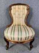 A Victorian carved walnut nursing chair. H.82 W.53 D.60cm