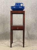 A Georgian mahogany washstand along with a jug and bowl. H.106 W.38 D.40cm.