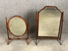Two 19th century mahogany swing action toilet mirrors. W.52 H.73cm (largest).