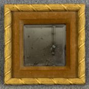 A gilt gesso and velvet framed wall mirror with bevelled plate. H.43 W.43cm