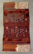 A kelim rug with all over stylised flowerhead and serrated palm motifs. H.200 W.101cm