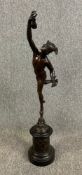 After Giambologna, an early 20th century patinated bronze figure of Mercury on a stepped and