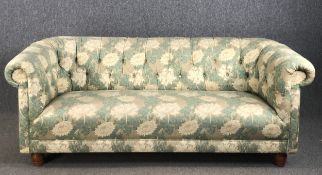 A Chesterfield sofa in deep buttoned William Morris style upholstery. W.192 H.75 D.90cm.