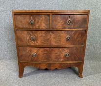 A 19th century flame mahogany and ebony strung chest of drawers. H.81 W.81 D.46cm