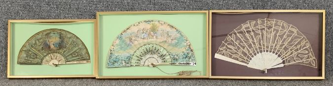 Three framed and glazed 19th century French fans; one hand painted with carved bone, one lace and