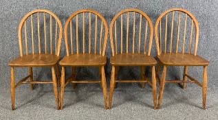 A set of four mid century Ercol low Windsor dining chairs in beech and elm. H.82cm (each)
