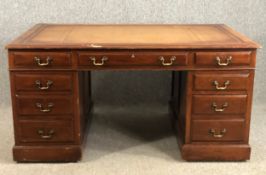 A C.1900 Georgian style mahogany pedestal desk, in three sections with inset leather top. H.75 W.152