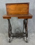 A late 19th century Willcox and Gibbs treadle sewing machine on it's wrought iron stand, with