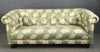 A Chesterfield sofa in deep buttoned William Morris style upholstery. W.192 H.75 D.90cm.