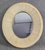 A distressed painted frame oval wall mirror. H.85 W.72cm