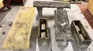A pair of weathered composite stone garden benches, a similar garden bench and a pair of similar