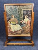 A vintage oak framed and glazed firescreen with tapestry insert. H.69 W.50 D.18cm