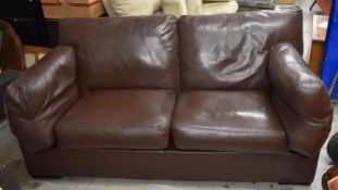 A brown leather John Lewis sofa. H.61 W.177 D.95cm