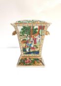 A 19th century Chinese Canton bough pot and cover decorated with four individual Rose Mandarin