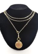 A Victorian rolled gold fancy pierced link and faceted rolo link guard chain and engraved circular