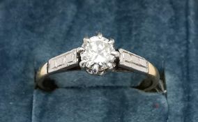 An Edwardian 18ct gold and platinum diamond solitaire ring, set to centre with a round old cut