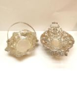 A German silver Lowenthal twin handled repousse design fruit bowl along with a Victorian silver