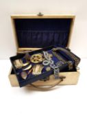 A jewellery box filled with a collection of antique and vintage jewellery, including a Victorian