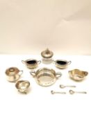 A collection of silver, including a twin handled porringer by Argyll Silver, a pair of silver urn