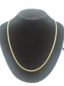 An Italian 18ct yellow gold flat curb link chain with C-sprung clasp. Stamped 750, assay mark for