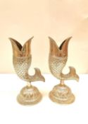 A pair of early 20th century Indian fish-shaped silver vases on repousse design pedestal bases,