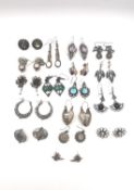 A collection of seventeen pairs of silver and white metal pierced earrings, including a pair with