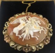 A Victorian carved bi-coloured metal (tests as 14ct) shell cameo brooch, the carved and pierced