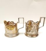 Two silver gilded and engraved floral design Russian openwork tea glass holders, one decorated